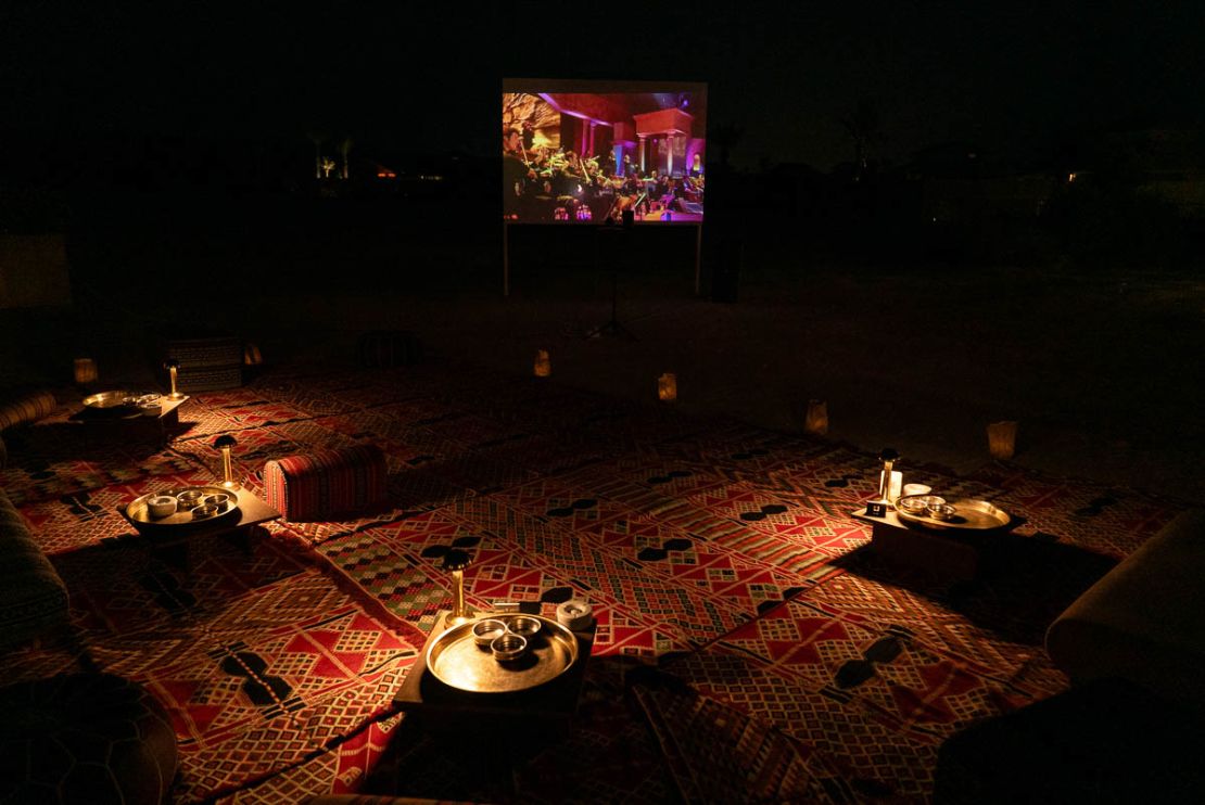 Guests can lie back on rugs to enjoy classic movies at the resort's open-air cinema.