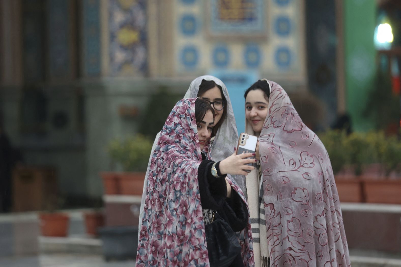 Iranian women take a selfie in the Imamzadeh Saleh shrine in Tehran, Iran.