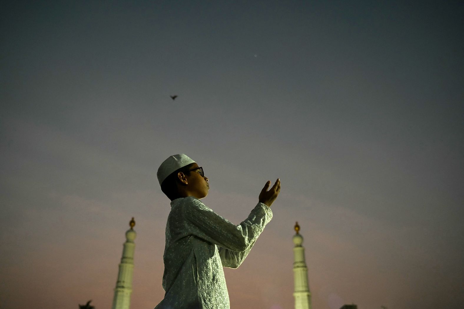 A young Muslim devotee offers prayers at a mosque ahead of Ramadan in Chennai, India.