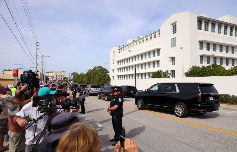 Vehicles that are part of the motorcade of former US President Donald Trump leave the US District Court Magistrate in Fort Pierce, Florida, on March 1.