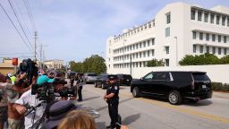 Vehicles that are part of the motorcade of former US President Donald Trump leave the US District Court Magistrate in Fort Pierce, Florida, on March 1.