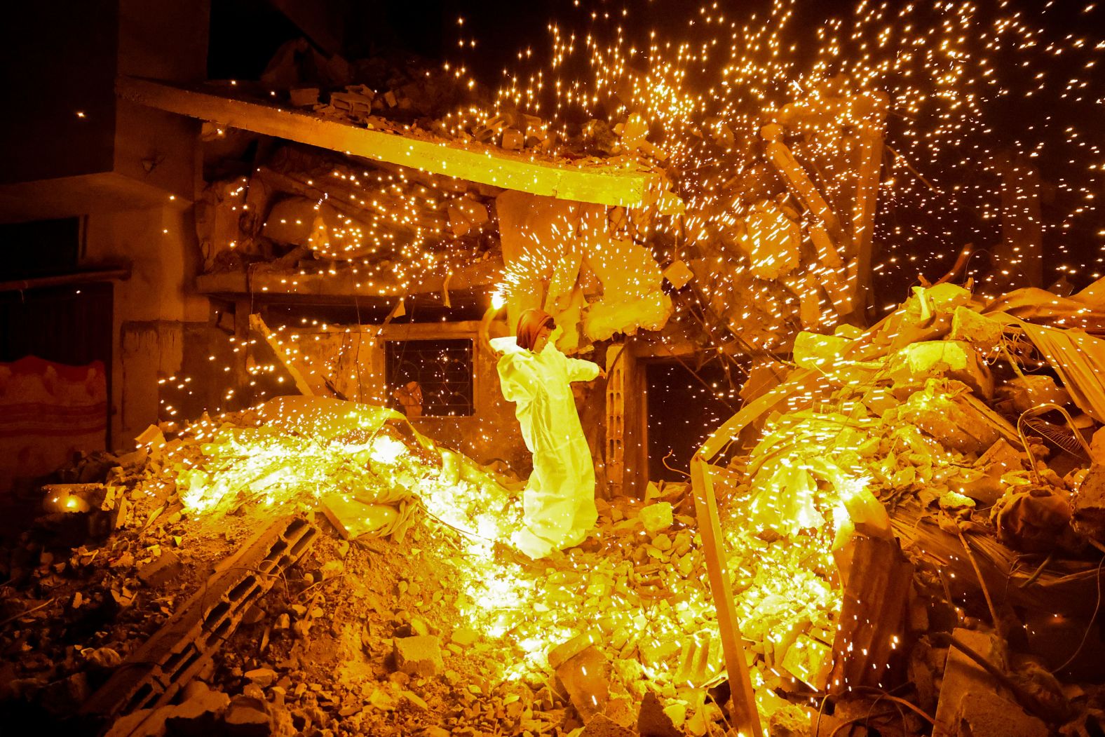 A child plays with a sparkler in Rafah, Gaza, on the eve of <a href="index.php?page=&url=http%3A%2F%2Fwww.cnn.com%2F2024%2F03%2F12%2Fworld%2Fgallery%2Framadan-2024%2Findex.html" target="_blank">Ramadan</a>, the Muslim holy month, on Sunday, March 10. For the children in Gaza, Ramadan brings a semblance of normalcy. <a href="index.php?page=&url=https%3A%2F%2Fwww.cnn.com%2F2024%2F03%2F13%2Fmiddleeast%2Fgaza-palestinians-ramadan-israel-siege-mime-intl%2Findex.html" target="_blank">But Palestinians told CNN</a> that Israel's war against Hamas has crushed hopes of observing a peaceful month of fasting, festivities and worship this year.