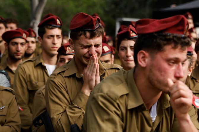 Israeli soldiers attend a funeral for Staff Sgt. David Sasson in Netanya, Israel, on Thursday, March 7. The Israel Defense Force announced a day earlier that Sasson, 21, had been killed while fighting in southern Gaza. Israel launched its military offensive in Gaza after the militant group Hamas killed at least 1,200 people and kidnapped more than 250 others in southern Israel on October 7.