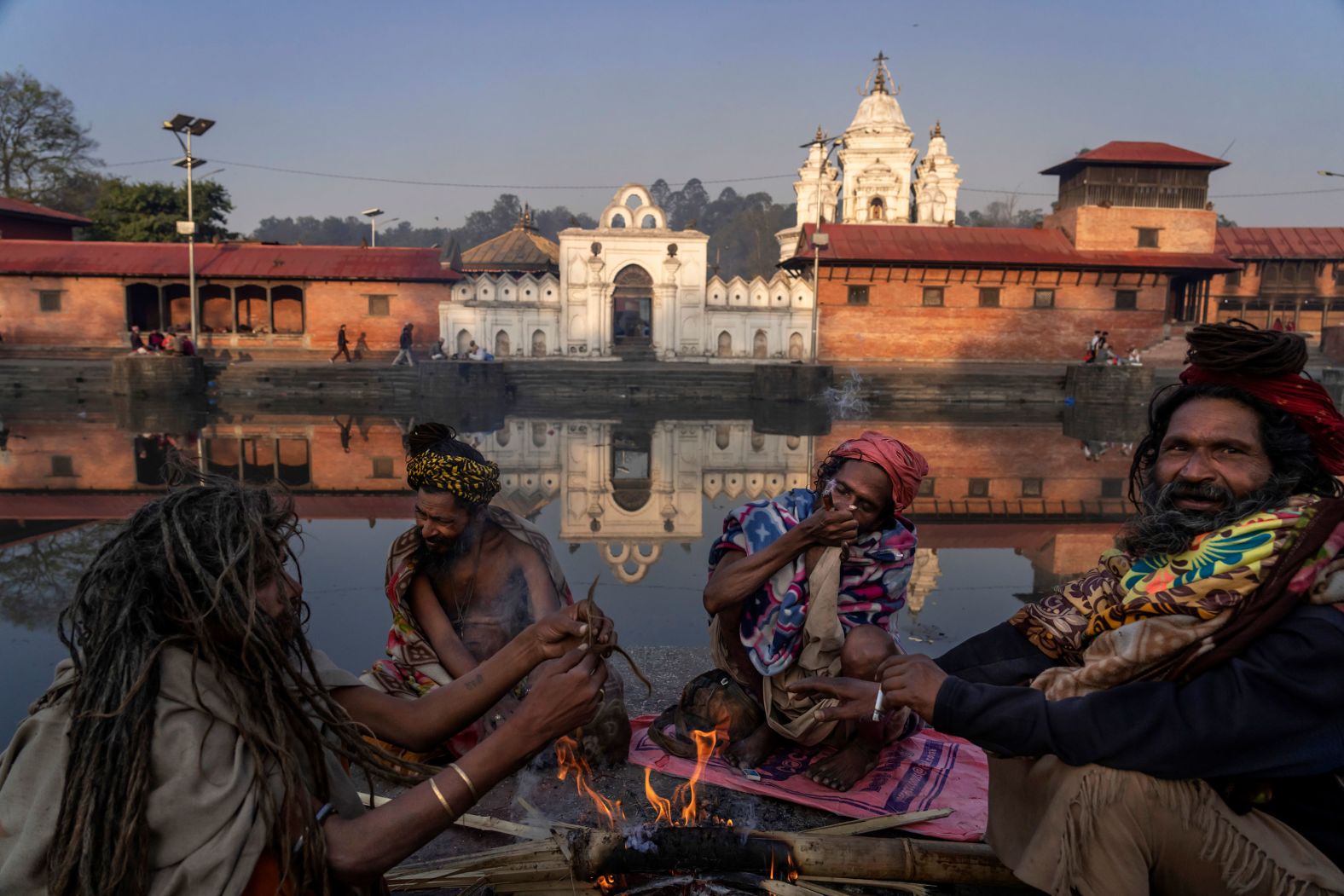 Hindu holy men from India smoke marijuana on the banks of the Bagmati River during the Maha Shivaratri festival in Kathmandu, Nepal, on Friday, March 8. 