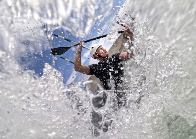 Slalom canoeist Finn Butcher paddles down a whitewater course in Auckland, New Zealand, on Wednesday, March 13. He qualified for the Summer Olympics that will take place later this year in Paris.