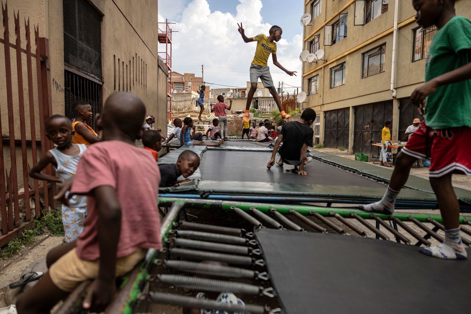 Children jump on trampolines in Alexandra, a South African township near Johannesburg, on Saturday, March 9.
