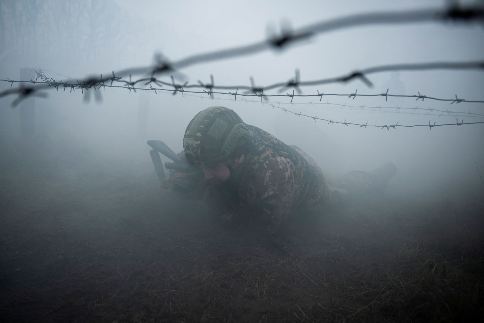 A new Ukrainian recruit takes part in a military exercise in central Ukraine on Tuesday, March 12.