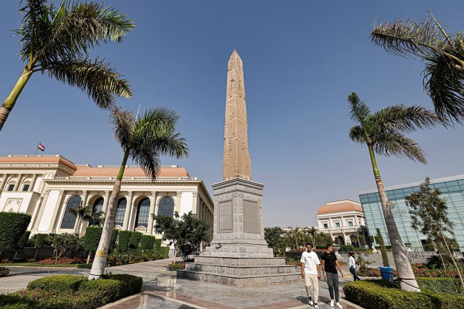 A restored ancient Egyptian obelisk of King Ramses II is on display outside the new capital library building (right) and the opera house (left).