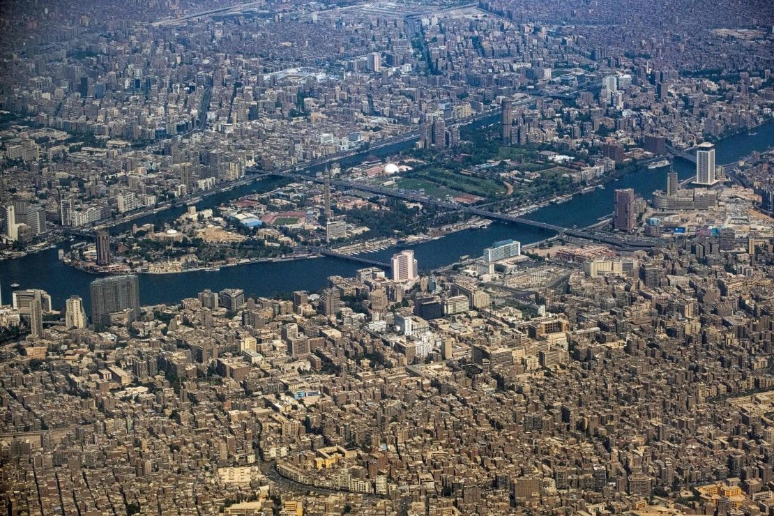 This picture taken on May 6, 2022 shows an aerial view of Cairo's Nile island of Zamalek and the nearby city centre area including Tahrir Square, while surrounded by the neighbourhoods of Garden City and Sayida Zeinab (bottom), and the capital's twin city of Giza (top). (Photo by Amir MAKAR / AFP) (Photo by AMIR MAKAR/AFP via Getty Images)
