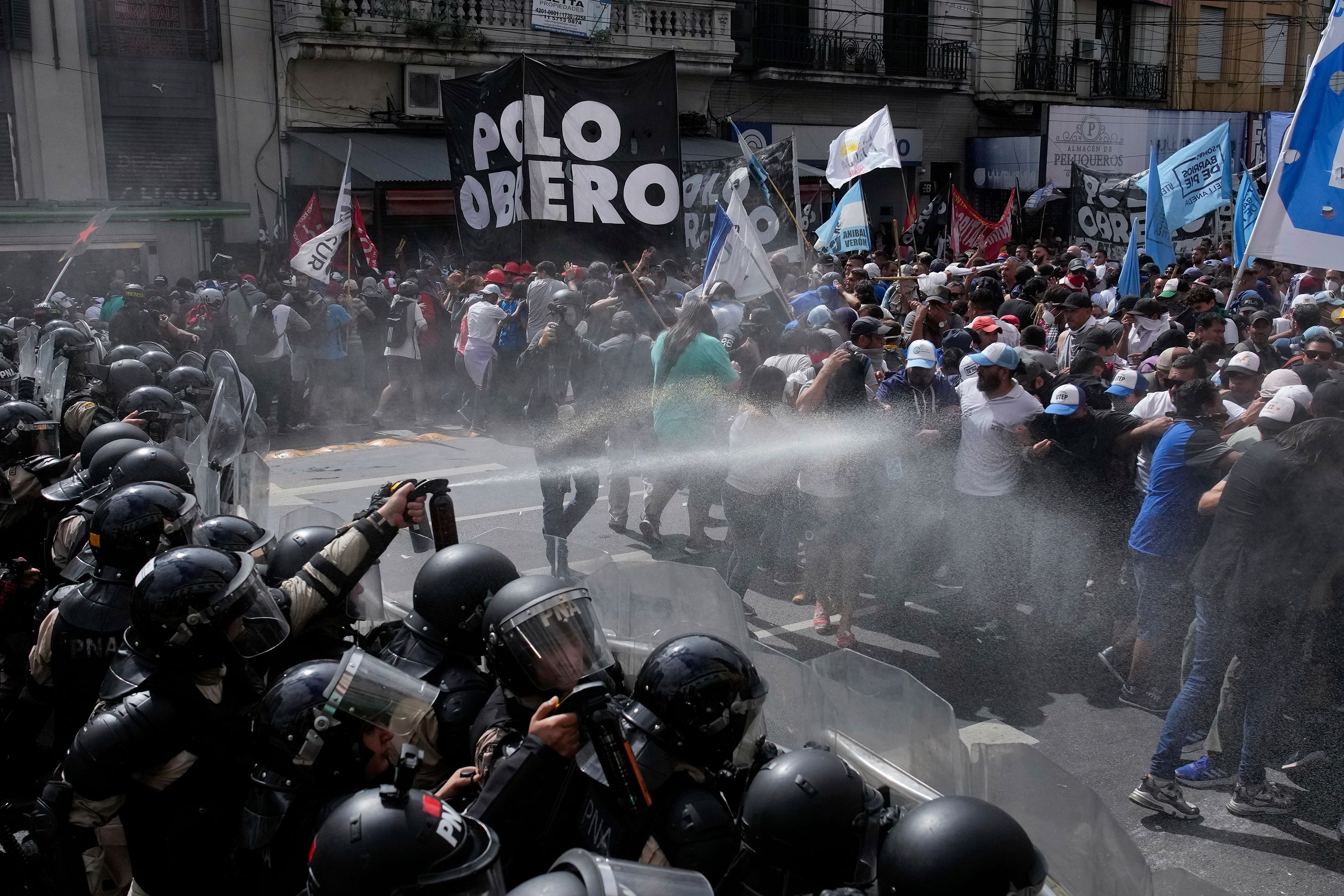 Police block an anti-government demonstration against food scarcity in Buenos Aires, Argentina, on Monday, March 18.