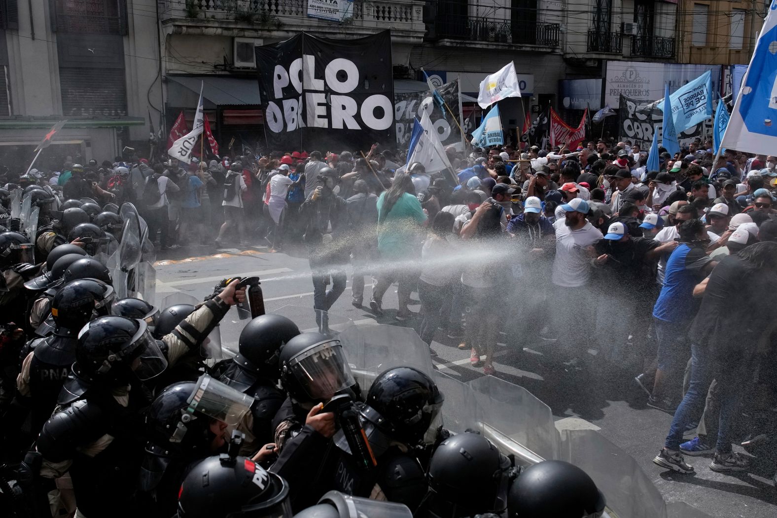 Police block an anti-government demonstration against food scarcity at soup kitchens and economic reforms proposed by Argentinian President Javier Milei in Buenos Aires, Argentina, on Monday, March 18.