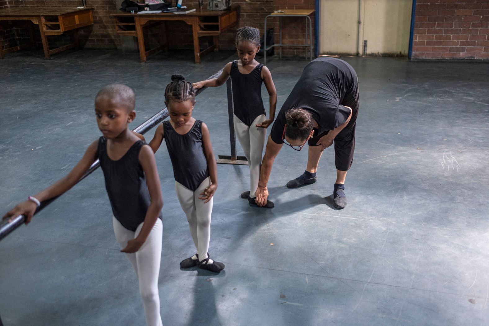 Ballet teacher Jo-Anne Wyngaard instructs a pupil during ballet class in Alexandra, near Johannesburg, on Tuesday, March 19.