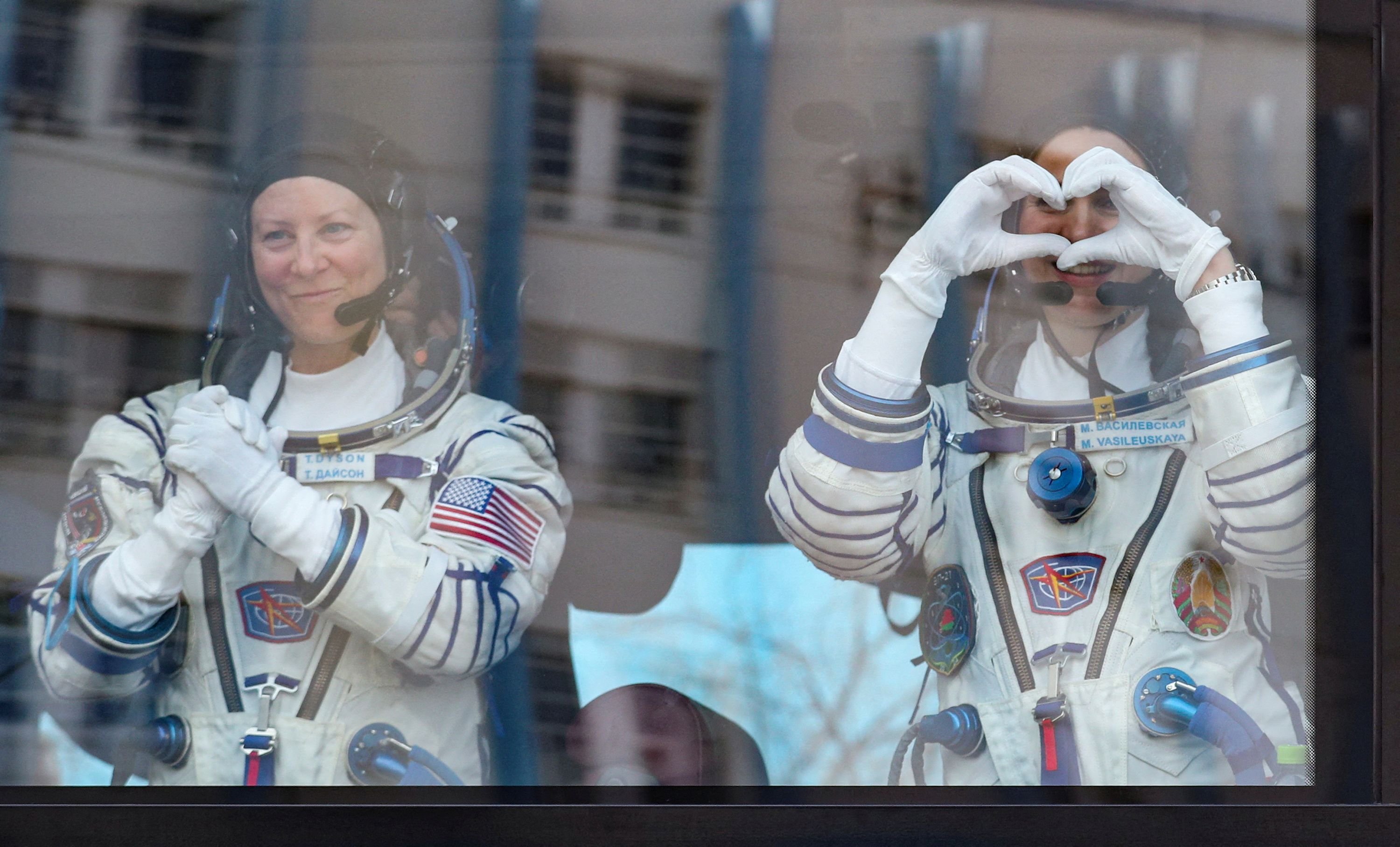 NASA astronaut Tracy Dyson and Marina Vasilevskaya react before their scheduled launch to the International Space Station in Kazakhstan on Thursday, March 21.