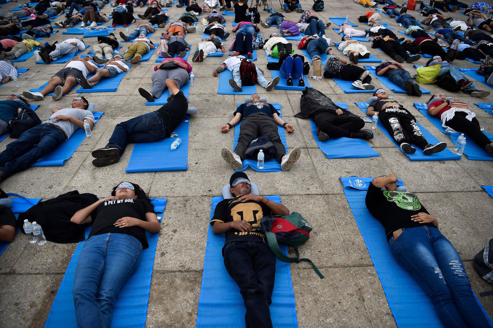 People nap during a World Sleep Day event in Mexico City on Friday, March 15.