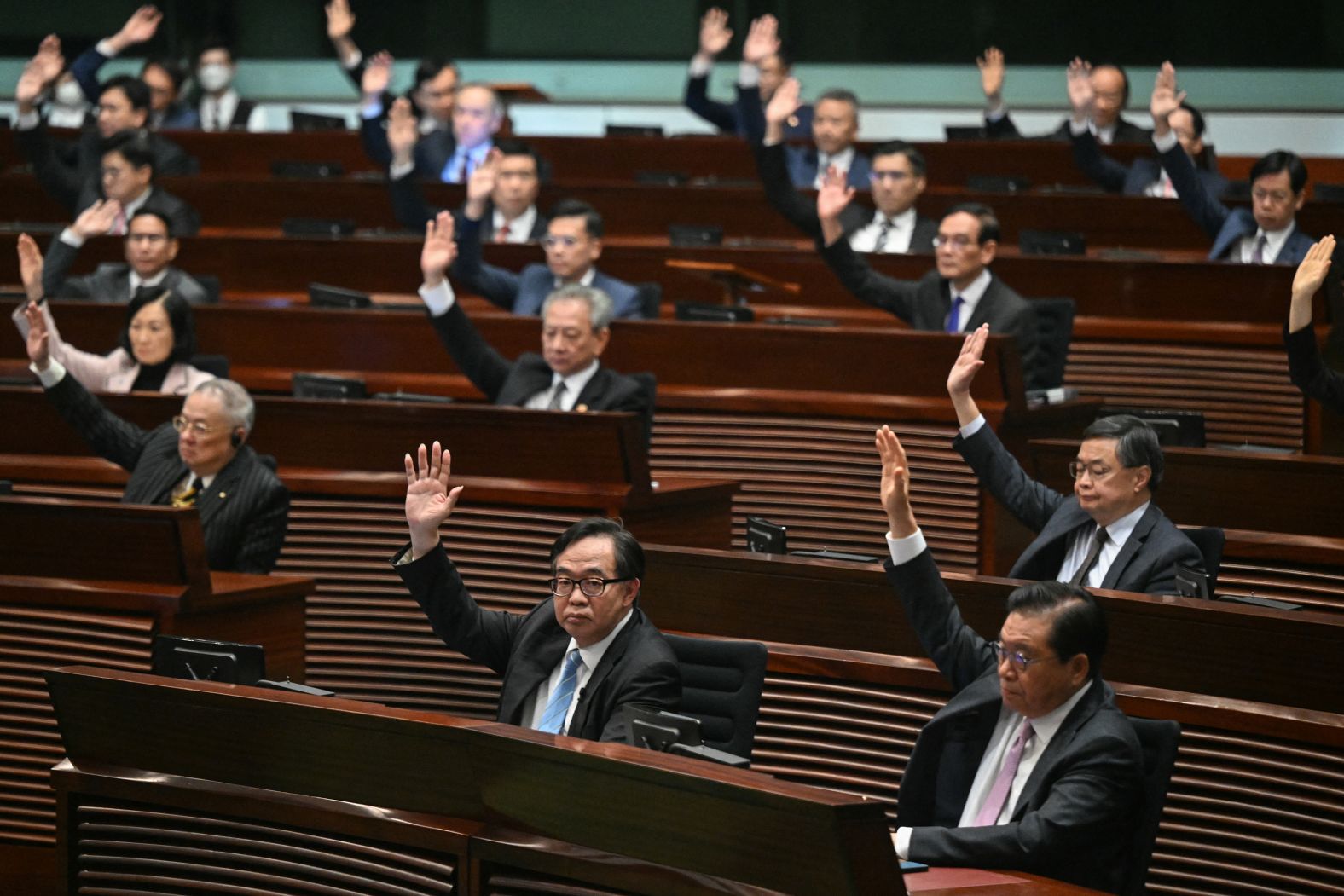 <a href="https://www.cnn.com/2024/03/19/china/hong-kong-second-national-security-law-passed-intl-hnk/index.html" target="_blank">Lawmakers vote for Article 23</a> in the chamber of the Legislative Council in Hong Kong on Tuesday, March 19. Hong Kong's legislature unanimously passed the bill, which critics and analysts warned would align the financial hub's national security laws more closely with those used on the Chinese mainland and deepen an ongoing crackdown on dissent.