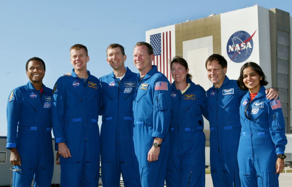The crew of NASA's STS-107 mission attends a news conference at Kennedy Space Center in Florida on December 20, 2002. Pictured from left are payload commander Michael P. Anderson; pilot William C. McCool; commander Rick D. Husband; mission specialist David M. Brown; mission specialist Laurel B. Clark; payload specialist Ilan Ramon; and mission specialist Kalpana Chawla.