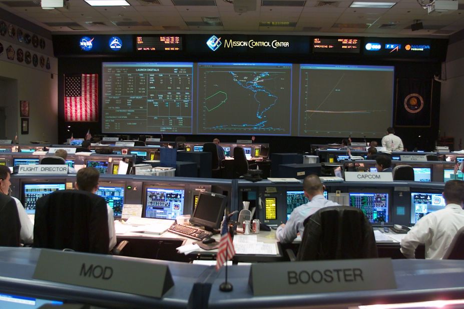 People work in the control room at NASA's Mission Control Center in Houston on January 16, 2003. Space Shuttle Columbia launched from the Kennedy Space Center in Florida at 10:39 a.m. ET.