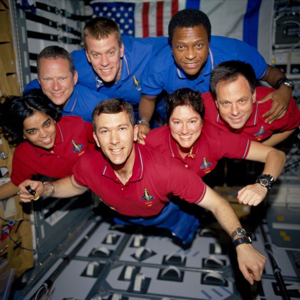The STS-107 crew pose for an in-flight portrait in the SPACEHAB RDM aboard Space Shuttle Columbia. This photo was on a roll of unprocessed film that searchers later recovered from debris.