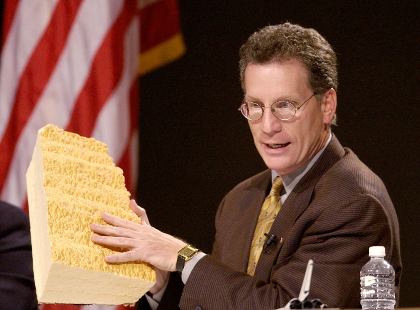 Ron Dittemore, NASA's space shuttle program manager, displays a piece of insulating foam, similar to that which coated Space Shuttle Columbia's fuel tank, during a briefing for the news media held at the Johnson Space Center in Houston on February 5, 2003.