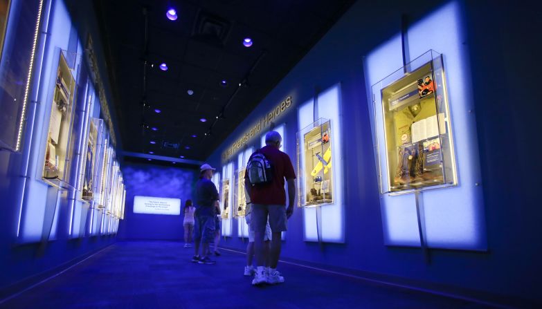 Visitors look at display cases at the "Forever Remembered" exhibit for the astronauts who died on the Columbia and Challenger space shuttles, at the Kennedy Space Center Visitor Complex in Florida, on July 21, 2015. <a href="https://www.kennedyspacecenter.com/explore-attractions/shuttle-a-ship-like-no-other/forever-remembered" target="_blank" target="_blank">The exhibit</a> is permanent and "displays personal items from each astronaut and recovered hardware from both orbiters, including a section of Challenger's left fuselage with American flag and the framework of Columbia's cockpit windows," according to the Kennedy Space Center website.