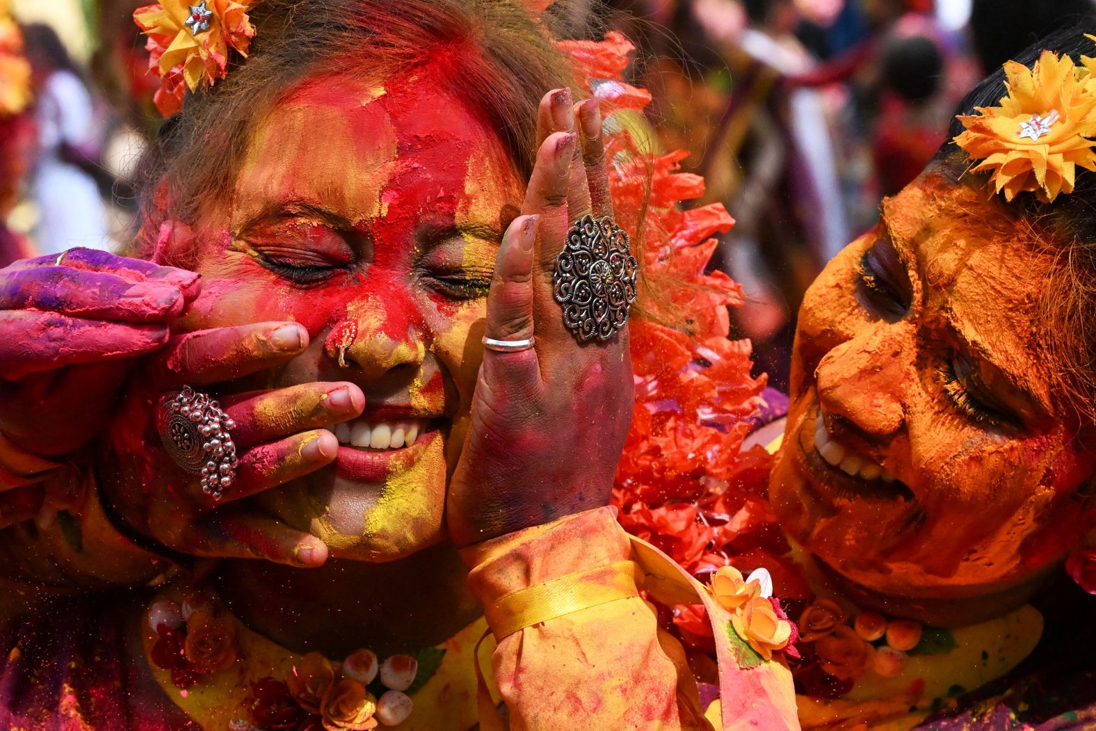 Women are smeared with colored powder as they celebrate Holi, <a href="index.php?page=&url=https%3A%2F%2Fwww.cnn.com%2F2023%2F03%2F07%2Fworld%2Fholi-2023-celebration-photos-cec%2Findex.html" target="_blank">the Hindu festival of love, color and spring</a>, in Kolkata, India, on Monday, March 25.