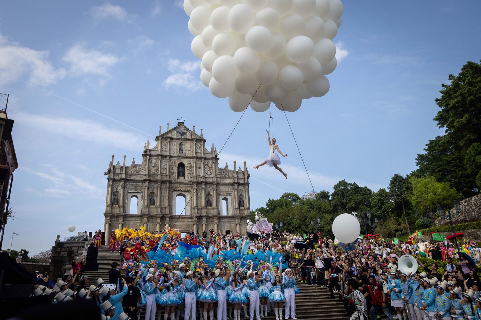 A performer dances over the Ruins of Saint Paul's during the Macao International Parade on Sunday, March 24. <a href="index.php?page=&url=http%3A%2F%2Fwww.cnn.com%2F2024%2F03%2F21%2Fworld%2Fgallery%2Fphotos-this-week-march-14-march-21%2Findex.html" target="_blank">See last week in 30 photos</a>.