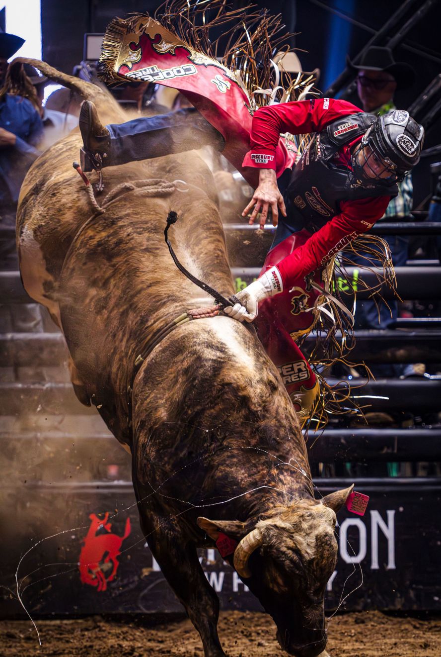 Jesse Petri flies off Punchy Pete during a Professional Bull Riders event in Albuquerque, New Mexico, on Friday, March 22. 