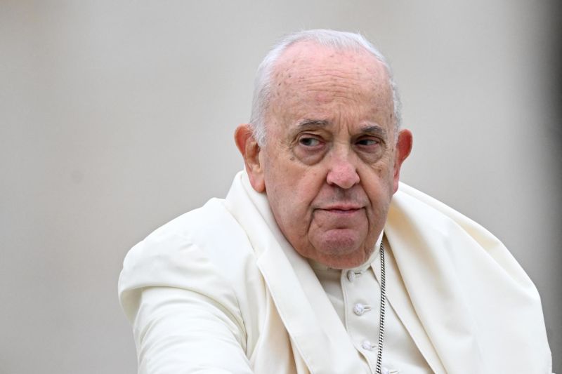 Pope Francis stands on the popemobile after the Easter Mass as part of the Holy Week celebrations, at St Peter's square in the Vatican on March 31, 2024.