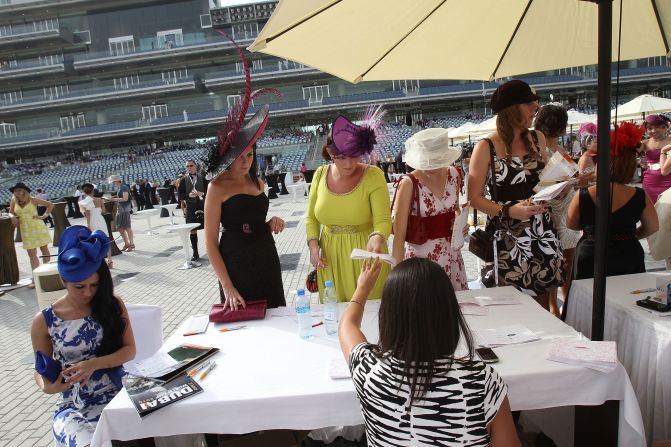 The Meydan had the world's first five-star trackside hotel, cementing the event's association with glamour. Pictured, women register for a fashion competition run by a local magazine, in 2010.