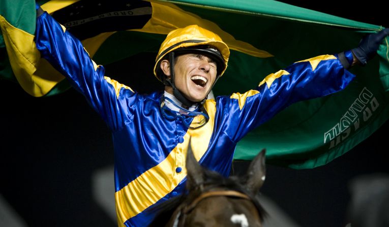 Brazilian Tiago Pereira, riding Gloria De Campeao, celebrates after winning the 2010 Dubai World Cup.
