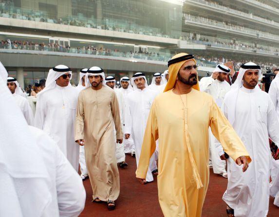 Dubai ruler Sheikh Mohammed bin Rashid al-Maktoum and his son, Crown Prince Sheikh Hamdan bin Mohammed bin Rashid Al Maktoum, arrive at Meydan Racecourse in 2011.