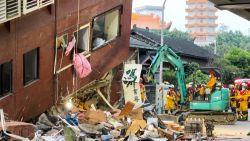 This frame grab from AFPTV video taken on April 3, 2024 shows rescue workers searching for survivors at the damaged Uranus Building in Hualien, after a major earthquake hit Taiwan's east. A major 7.4-magnitude earthquake hit Taiwan's east on the morning of April 3, prompting tsunami warnings for the self-ruled island as well as parts of southern Japan and the Philippines. (Photo by AFPTV / AFP) (Photo by STR/AFPTV/AFP via Getty Images)