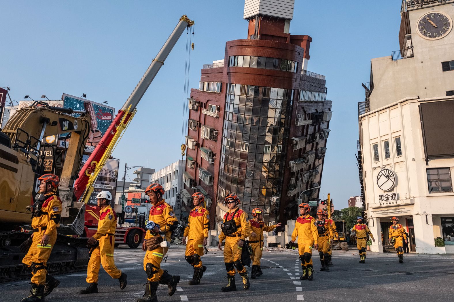 Search-and-rescue workers prepare to enter a leaning building in Hualien, Taiwan, after a <a href="index.php?page=&url=https%3A%2F%2Fwww.cnn.com%2F2024%2F04%2F02%2Fasia%2Ftaiwan-earthquake-tsunami-warning-intl-hnk%2Findex.html" target="_blank">7.4 magnitude earthquake</a> struck on Wednesday, April 3. It was the island's strongest earthquake in 25 years. At least nine people were killed, and more than 900 were injured.