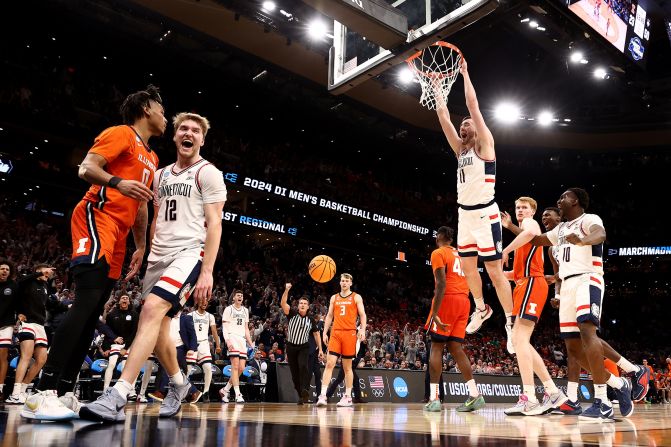 UConn forward Alex Karaban dunks the ball during <a href="https://www.cnn.com/2024/03/31/sport/alabama-uconn-march-madness-final-four-spt-intl/index.html" target="_blank">the team's NCAA Tournament victory over Illinois</a> on Saturday, March 30. The Huskies went on a 30-0 run during the 77-52 win, clinching their second straight Final Four appearance. <a href="http://www.cnn.com/2023/04/03/sport/gallery/san-diego-state-uconn-ncaa-mens-final-photos/index.html" target="_blank">They won the title last year</a>.