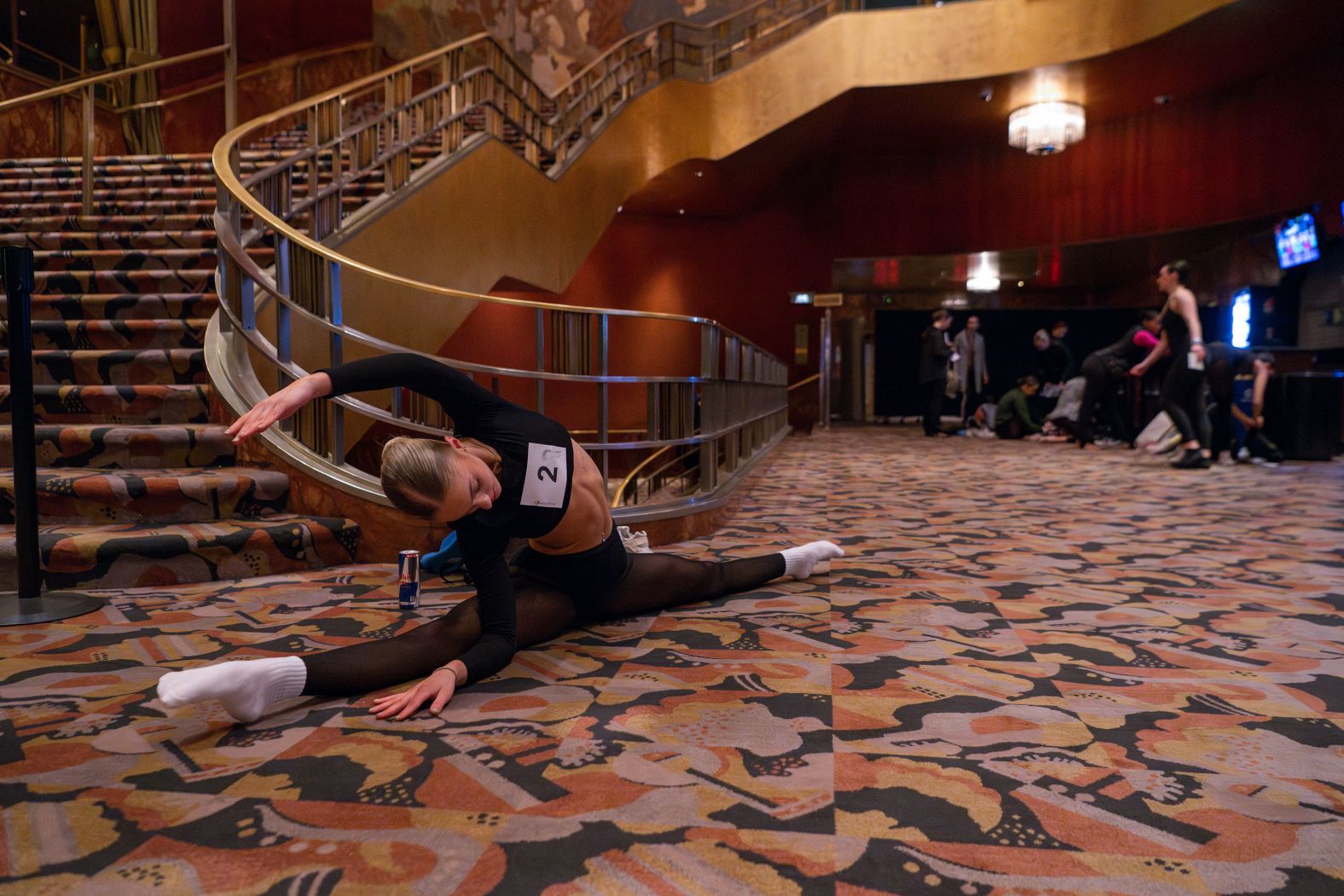 Emily Whiteford stretches inside New York's Radio City Music Hall before auditioning for the Radio City Rockettes on Wednesday, April 3.