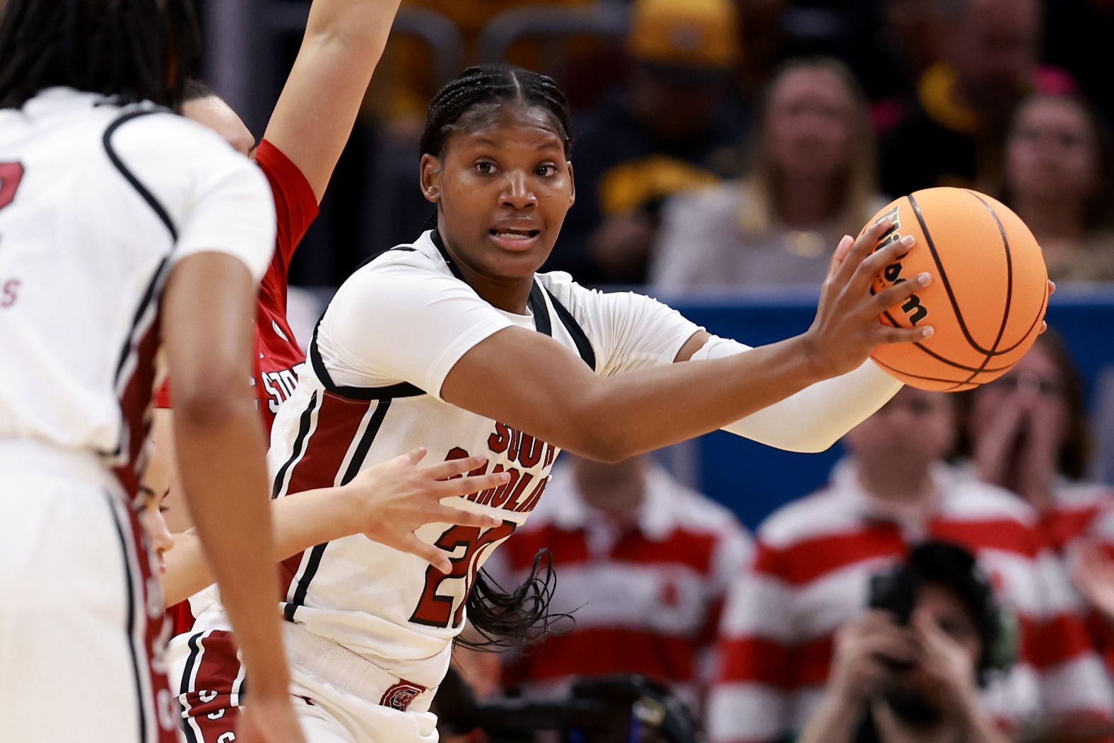 Katie Peneueta of the NC State Wolfpack looks for an opening during the first half.