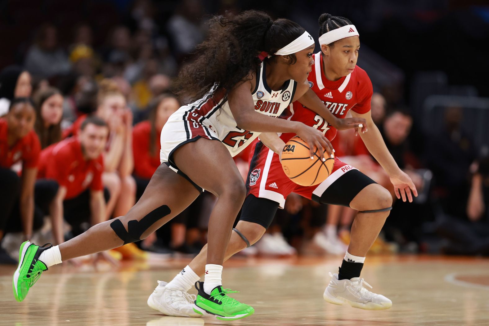 South Carolina's Raven Johnson drives around Zoe Brooks of NC State during the first half. The Gamecocks let 32-31 at halftime.