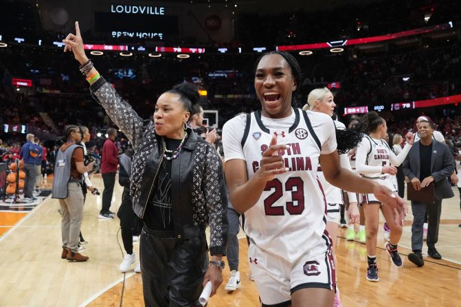 South Carolina coach Dawn Staley and guard Bree Hall celebrate after defeating the NC State Wolfpack 78-59 in the Final Four of the women's tournament