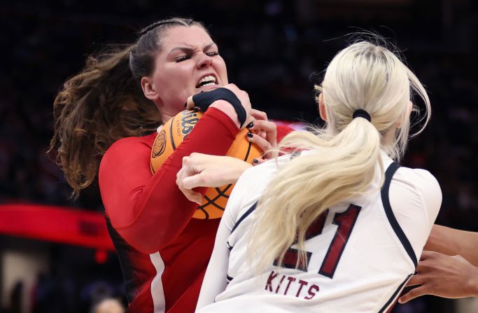 NC State's River Baldwin fights Chloe Kitts of South Carolina for possession of the ball in the second half.