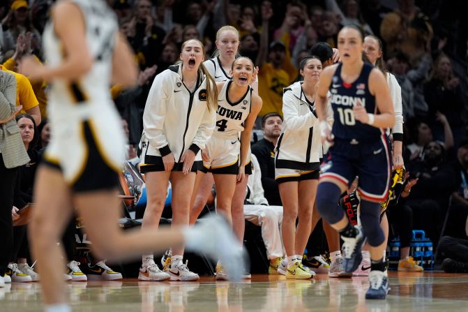 Iowa players react from the bench during the second half.