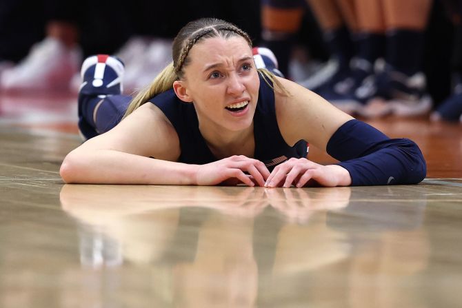 UConn guard Paige Bueckers lays on the floor in the second half.