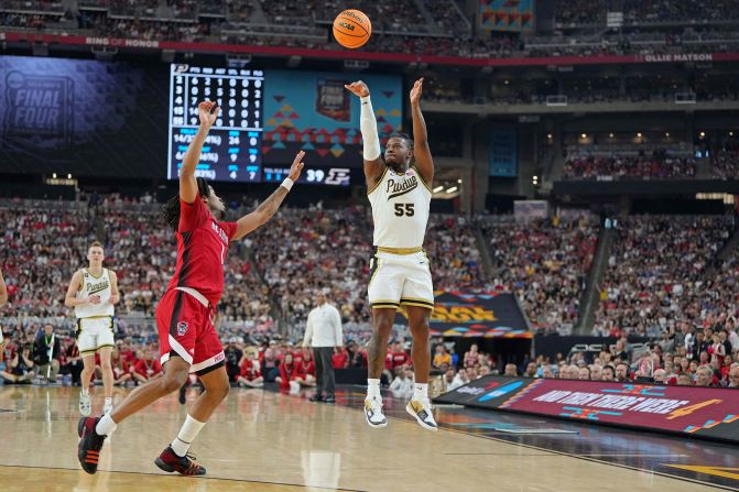 Purdue guard Lance Jones shoots the ball against NC State guard Jayden Taylor in the second half. Jones added 14 points during the game.