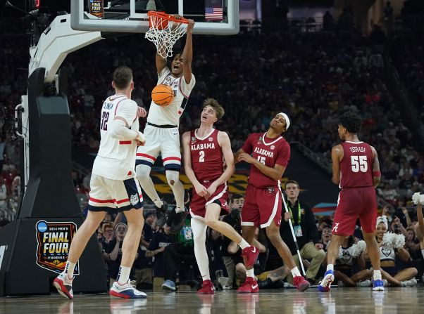Huskies guard Stephon Castle throws down a dunk. He was UConn's leading scorer with 21 points.