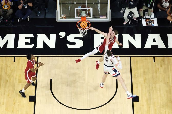 Alabama's Grant Nelson dunks over Clingan in the second half. Nelson racked up 19 points during the game.