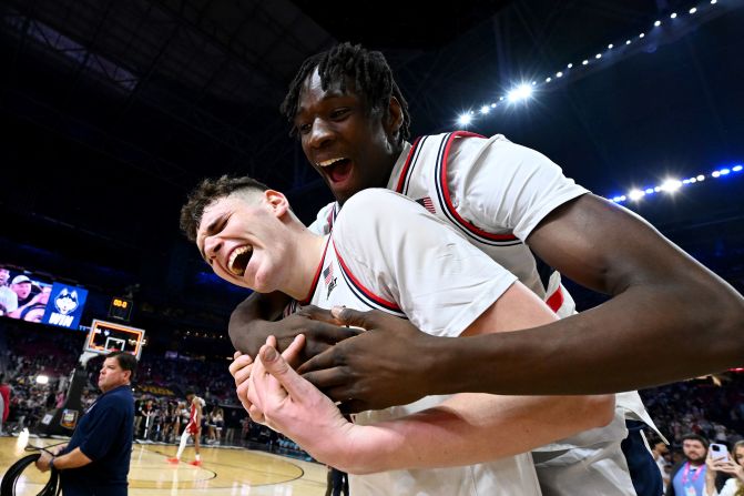 UConn's Donovan Clingan and Youssouf Singare celebrate their 86-72 victory over Alabama in the Final Four game on Saturday.