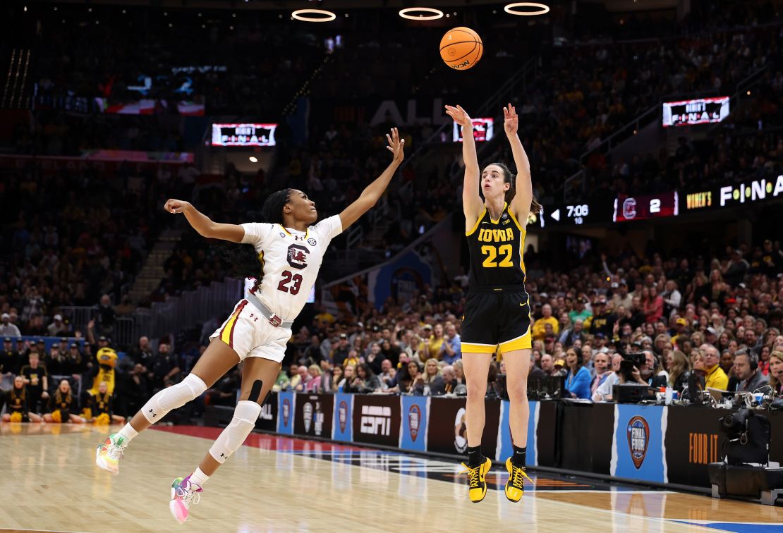 CLEVELAND, OHIO - APRIL 07: Caitlin Clark #22 of the Iowa Hawkeyes shoots a three point basket over Bree Hall #23 of the South Carolina Gamecocks in the first half during the 2024 NCAA Women's Basketball Tournament National Championship at Rocket Mortgage FieldHouse on April 07, 2024 in Cleveland, Ohio. (Photo by Gregory Shamus/Getty Images)