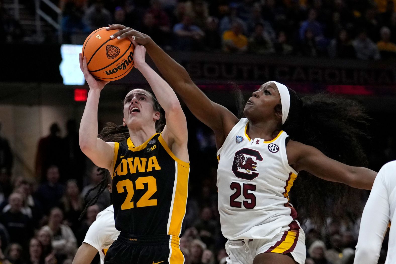 South Carolina guard Raven Johnson blocks a shot by Clark.