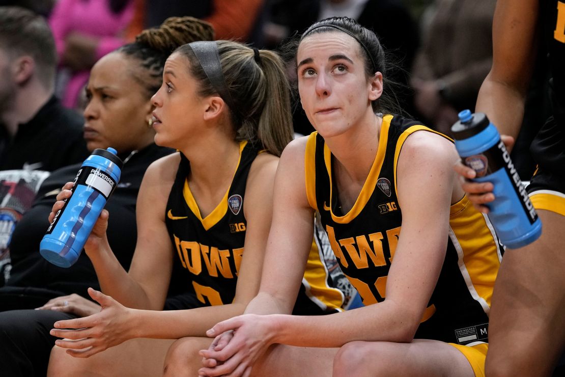 Iowa guard Caitlin Clark sits on the bench at the end of the Final Four college basketball championship game against South Carolina in the women's NCAA Tournament, Sunday, April 7, 2024, in Cleveland. South Carolina won 87-75. (AP Photo/Morry Gash)