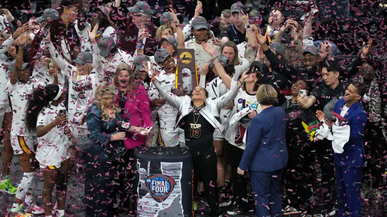 Apr 7, 2024; Cleveland, OH, USA; The South Carolina Gamecocks are presented with the trophy after defeating the Iowa Hawkeyes in the finals of the Final Four of the womens 2024 NCAA Tournament at Rocket Mortgage FieldHouse. Mandatory Credit: Aaron Doster-USA TODAY Sports