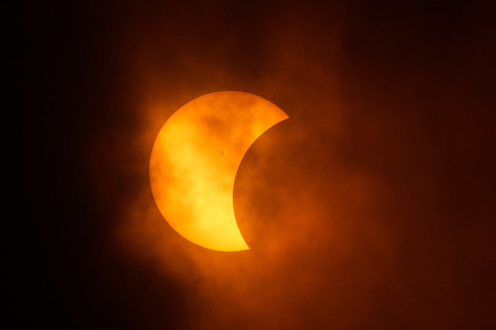 The moon begins to cover the sun in Eagle Pass, Texas.